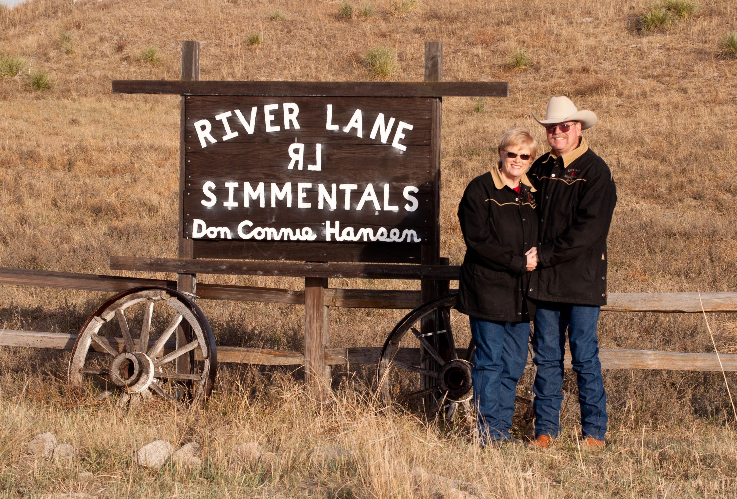 Ranch sign with wagon wheels